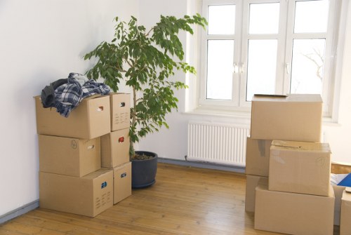 Professional movers protecting furniture during relocation in South London
