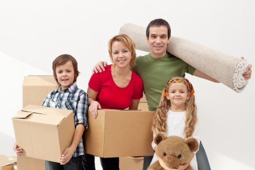 Mover carrying household items from a flat in Elephant and Castle